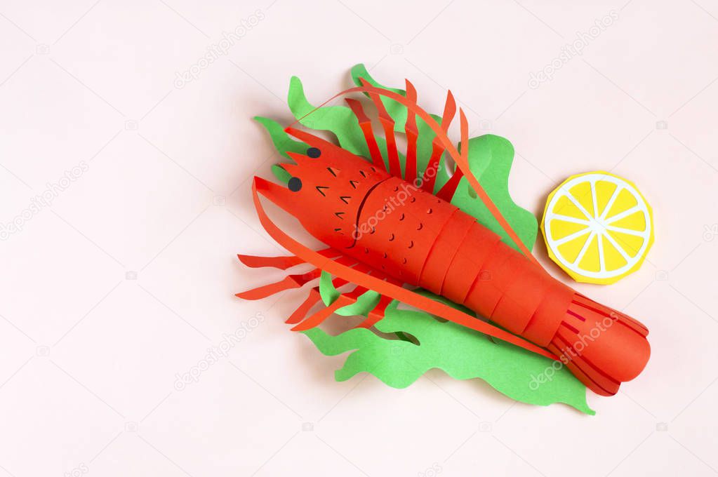 Paper lobster with lettuce and lemon slices 