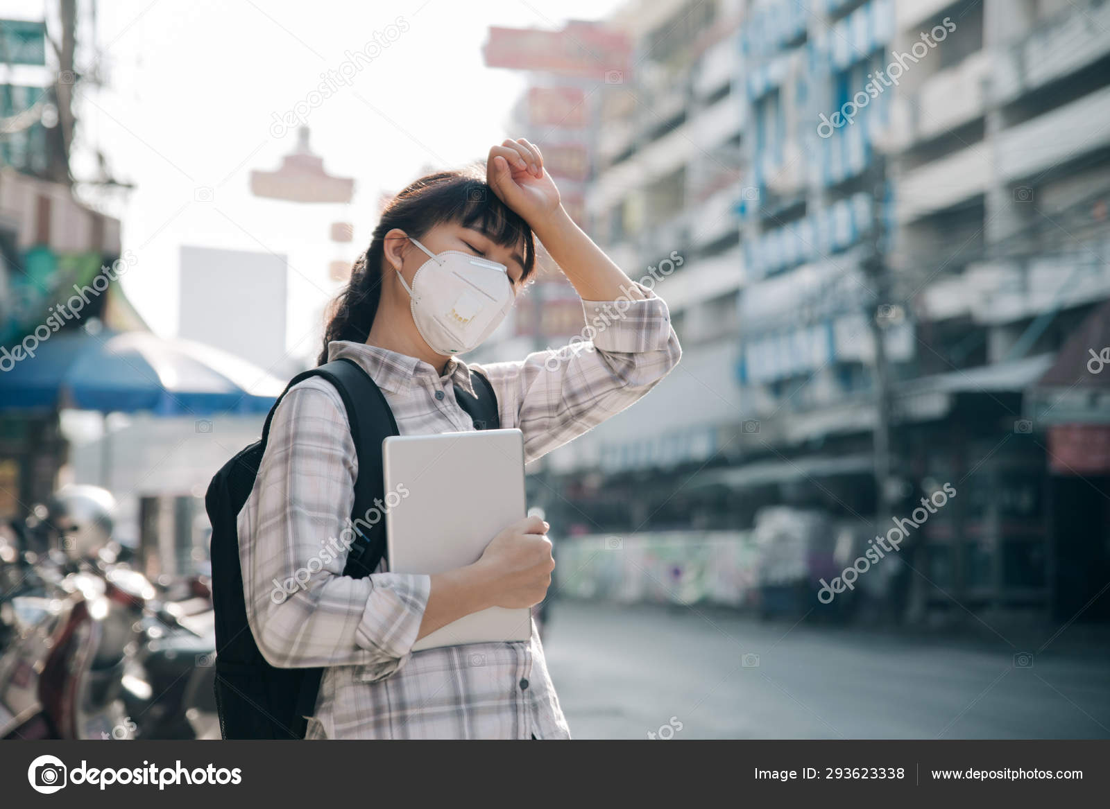 Women wearing a mask headaches from air pollution.Protection aga