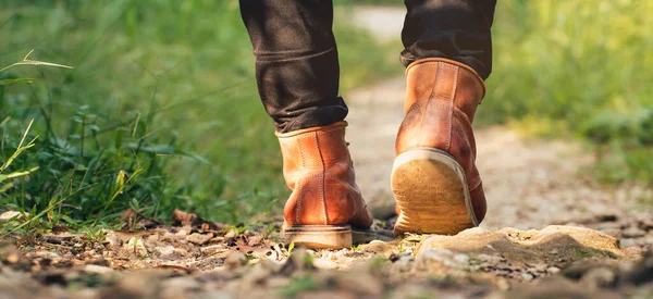 Feet Man hiking outdoor and forest on background Lifestyle Travel survival concept