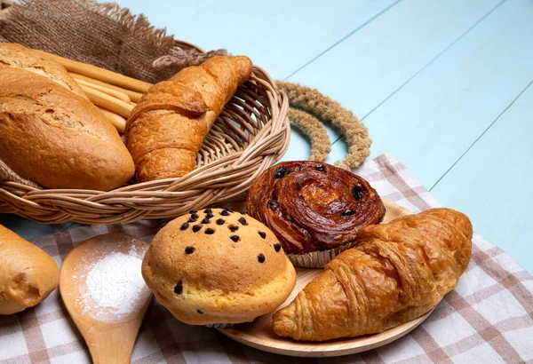 Bakery Bread Blue Wooden Table Various Bread Sheaf Wheat Ears — Stock Photo, Image