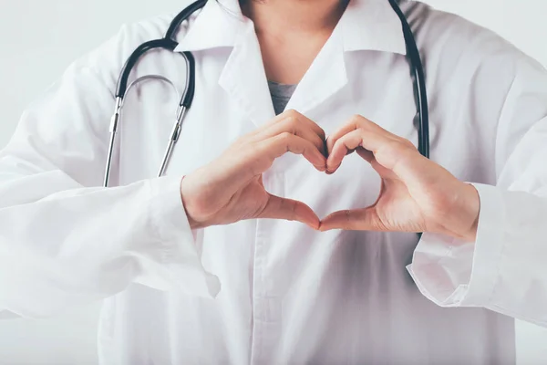 Doctor making hands in heart shape, heart health insurance,donation charity organ donor and world heart health day concept