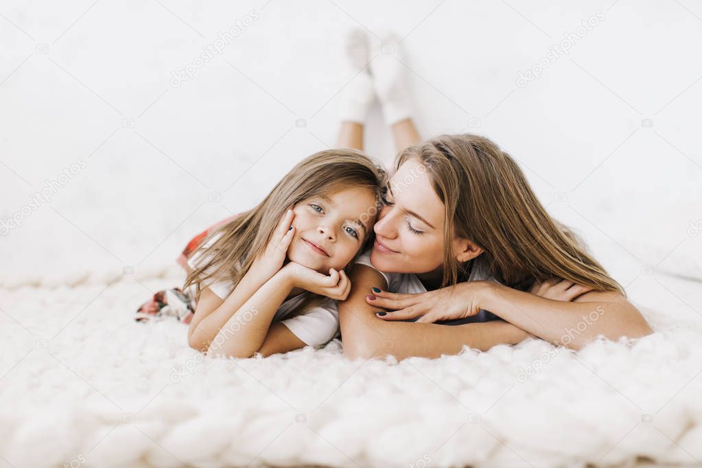 young beautiful mother with her daughte