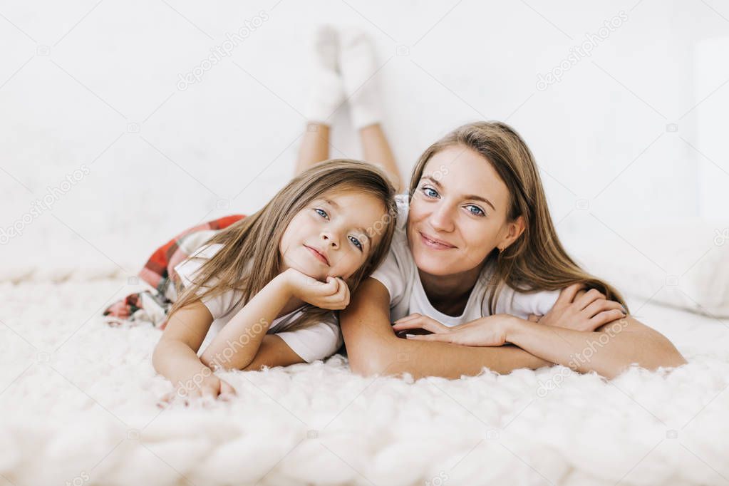 young beautiful mother with her daughte