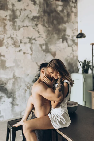 Beautiful Loving Couple Kissing Kitchen Stock Image