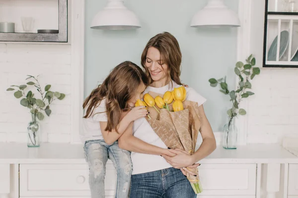 Little Girl Gives Flowers Mother March — Stock Photo, Image