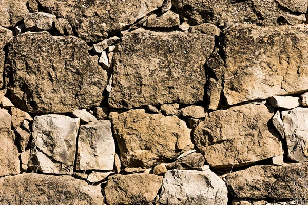 Ancient stone wall in a rural zone. Old stones texture. Dry stone "pedras Seca" . Outdoors txtured. — Stock Photo, Image