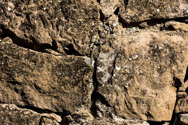 Ancient stone wall in a rural zone. Old stones texture. Dry stone "pedras Seca" . Outdoors txtured. — Stock Photo, Image