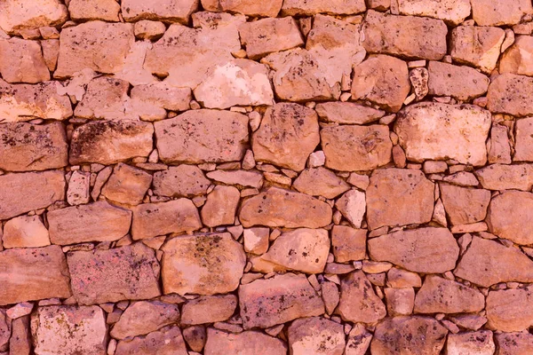 Parede de pedra antiga em uma zona rural. Textura de pedras velhas. Pedra seca "pedras Seca". Ao ar livre txtured . — Fotografia de Stock