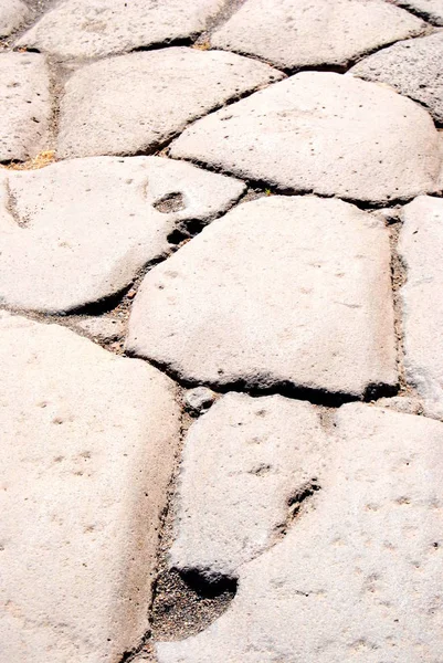 Pavimento de piedra en una ciudad antigua. pavimento de piedra con dibujos . — Foto de Stock
