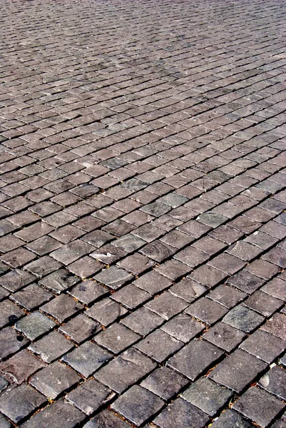 Pavimento de piedra en una ciudad. pavimento de piedra con dibujos . — Foto de Stock