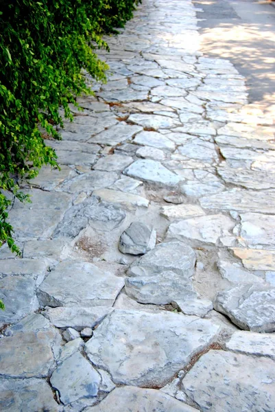 Stone pavement in Athens, in the way to the Parthenon.city. patterned stone pavement.