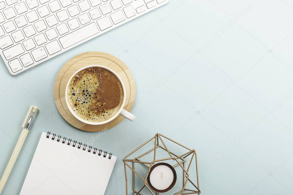 Creative work space background with keyboard, coffee and stationery