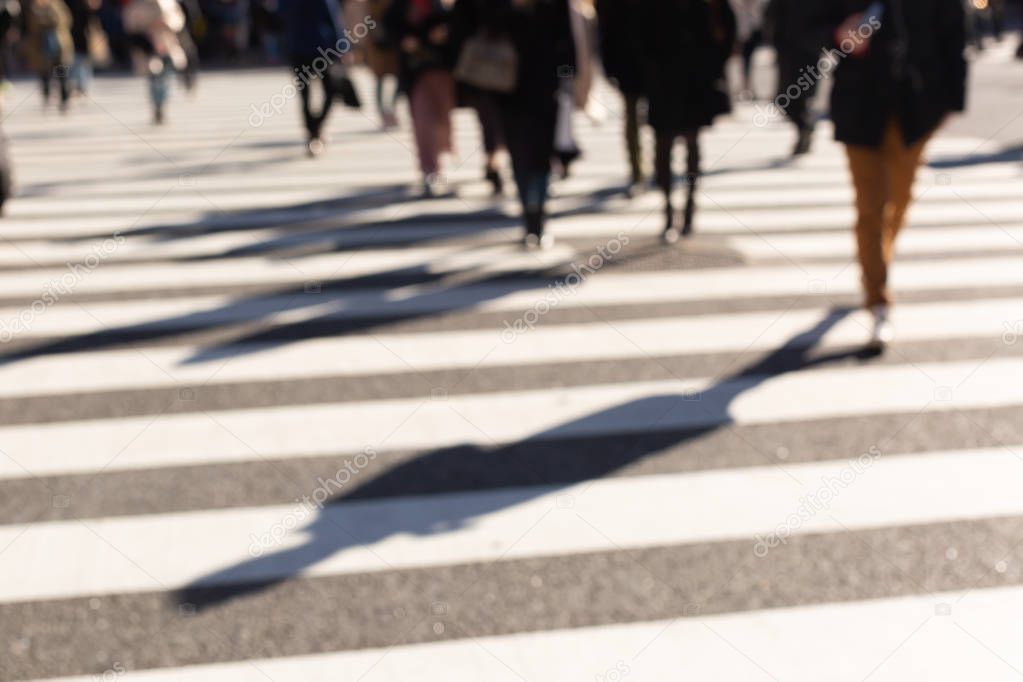 Blurred people on crosswalk