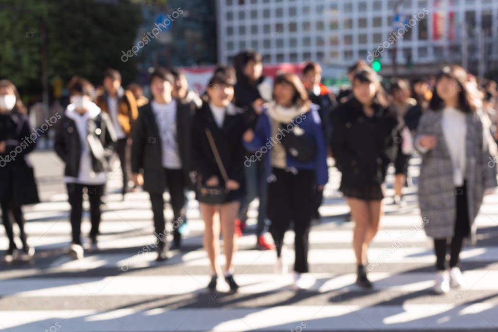 Blurred people on crosswalk