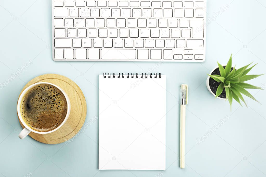 Creative work space background with keyboard, coffee and station