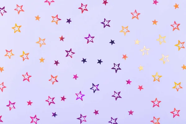 Festive background. Stars confetti on blue paper. — Stock Photo, Image