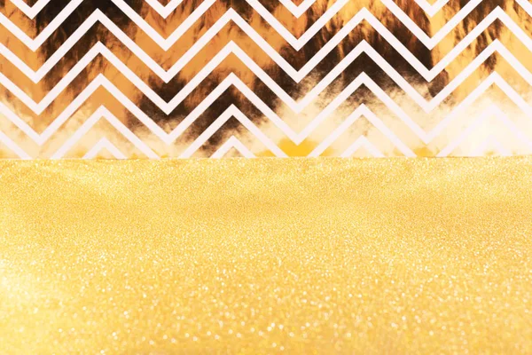 Bright gold glitter en zigzag combinatie achtergrond. — Stockfoto