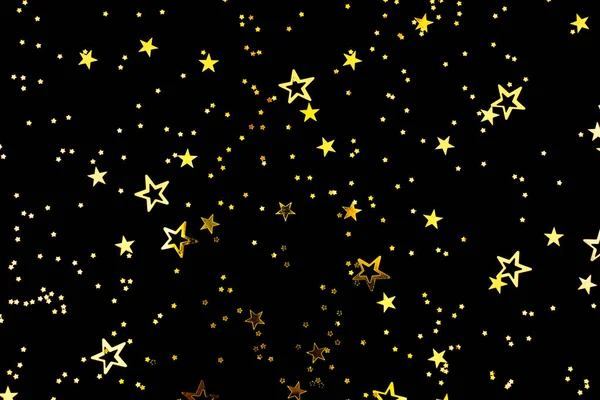 Vallende ster vorm confetti op zwarte achtergrond. — Stockfoto