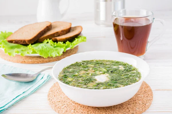 Okroshka is a traditional Russian dish. Cold soup with vegetables and herbs dressed with bread kvass
