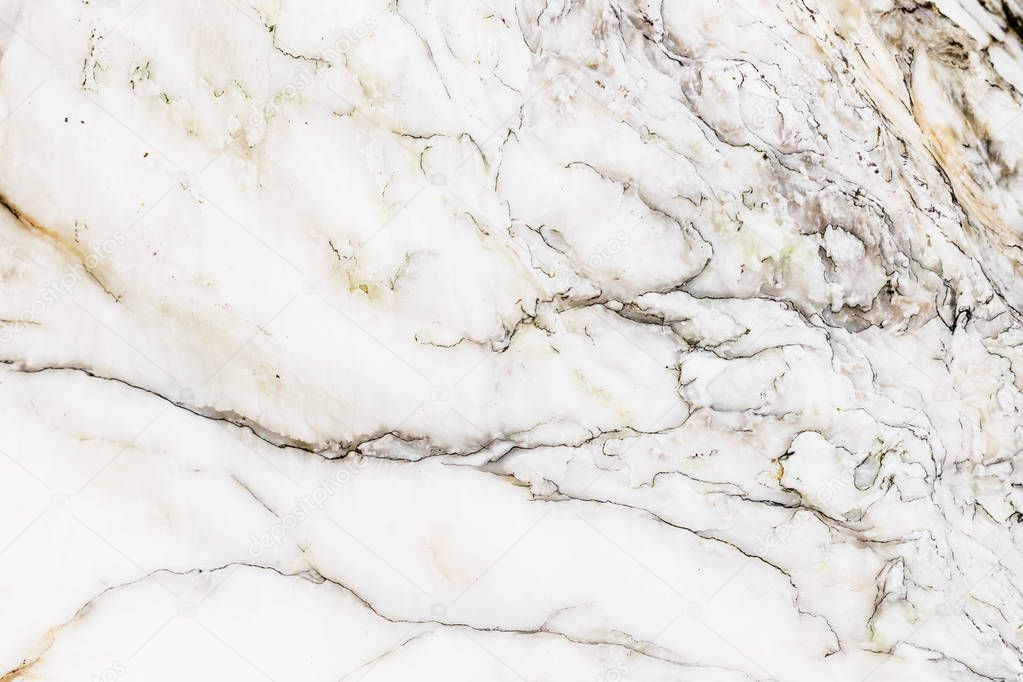 Natural unpolished White marble texture with dark pattern for background or design art work. Unprocessed surface of marble stone