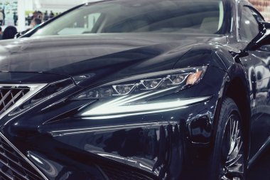 Lexus new car at motor show, Automobile Salon. Lexus LS 500h  new flagship luxury sedan, selective focus