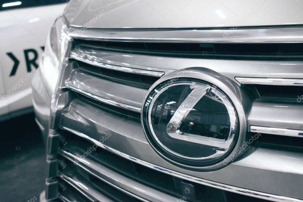 Close up Lexus metac logo closeup on the Lexus car at motor show, Automobile Salon. Lexus new luxury car, selective focus