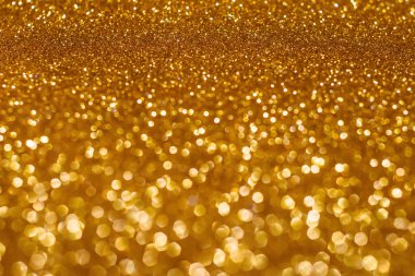 Noel tatili bokeh arka plan altın ışıkları ile soyut. Glitter altın bokeh arka plan