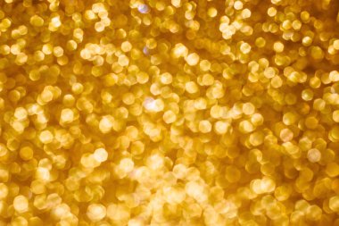 Noel tatili bokeh arka plan altın ışıkları ile soyut. Glitter altın bokeh arka plan
