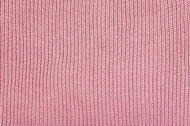 Pembe örgülü kumaş arka planı. Örülmüş yün kumaş gül Textu.