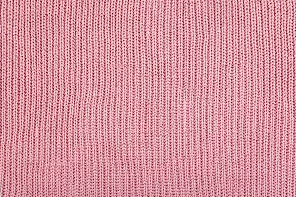 Pink Knitted Fabric background. Knitted woolen fabric rose Textu