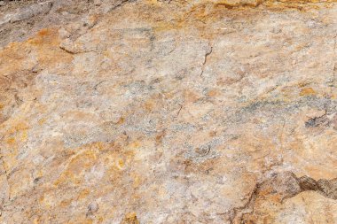 Taş kaya dokusu arka planı. Dağdaki taş doğa geri döndü.