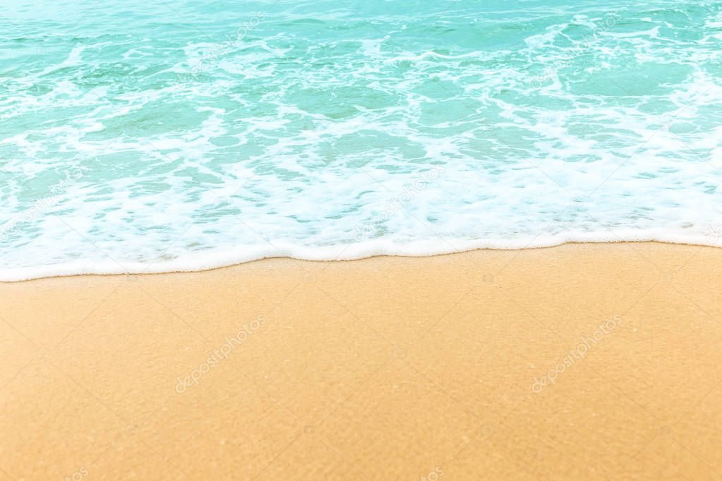 Beautiful soft wave on the beautiful beach with copy space on the nice sand for using advertisement of traveling, vacation or other thing in summer season or putting some text. It look like a paradise