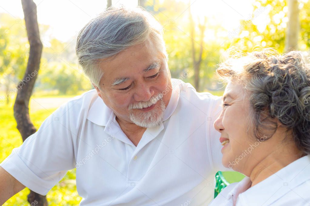 Portrait older couple or retirement people. Attractive grandfather look at his wife or grandmother with love. Grandpa and grandma has good health. Senior couple get happiness. They are romantic couple