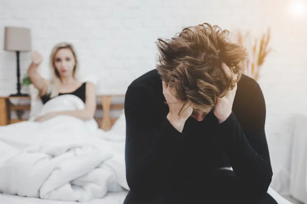 Handsome man disappointed himself that his wife get disappointed him because he get premature evacuation. Man get shy and failure. Guy get sadness, unhappy and lost confidence with unsatisfied woman — Stock Photo, Image