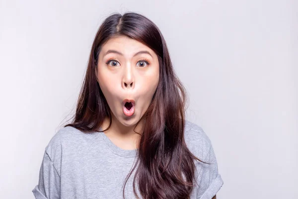 Expression concept. Beautiful asian woman says wow and gets shocked, surprised or wonder when pretty girl see something, product that she like or love. She has long hair. copy space, white background — Stock Photo, Image