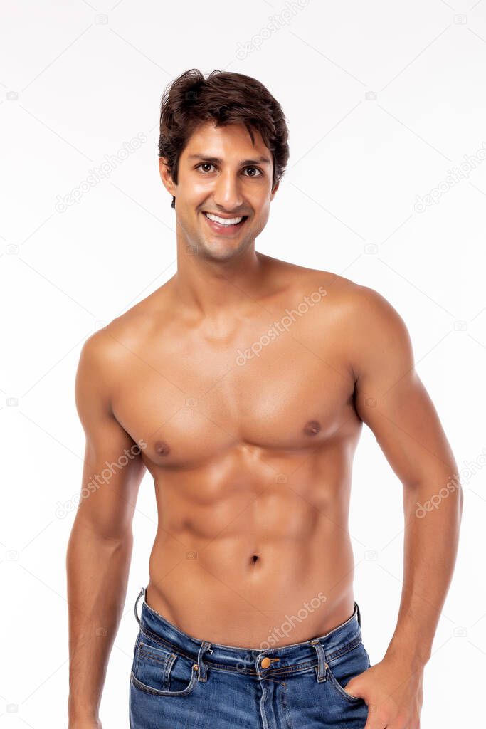 Portrait attractive young muscle man on white background. Handsome muscle guy has perfect body. Glamour male get successful of lose weight. He wear jeans, get shirtless. He get confident, happy. smile