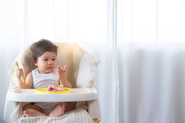 Cute Little Girl Learn Eating Sweet Herself First Time Inquisitive — Stock Photo, Image