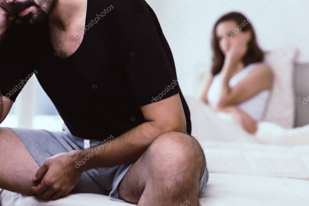 Upset mature couple ignoring each other. Close up worried man in tension at bed. Mature couple angry with each other after argument. Husband get sad and despair when his wife told him for break up
