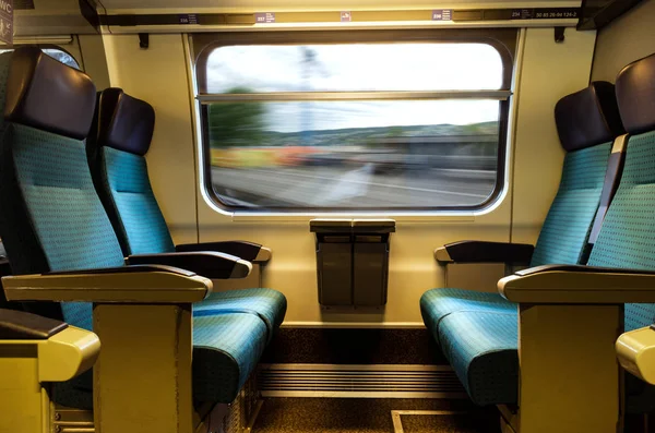 Moving train four empty coach seath blue upholstery swiss sbb ra