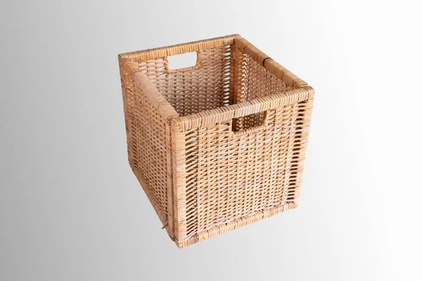 Brown cubic woven storage basket isolated on white side view.