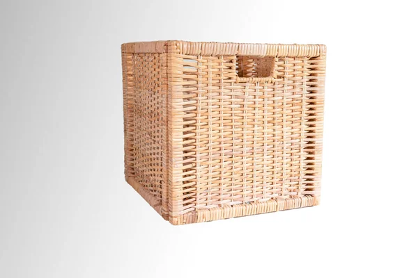 Brown cubic woven storage basket isolated on white side view.