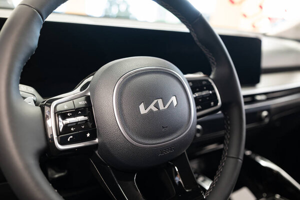 Safenwil, Switzerland, August 16, 2025. New KIA Ceed compact segment family car interior view. Emil Frey open days showroom floor, wide angle view, window light