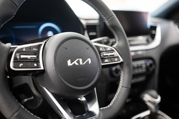 Safenwil, Switzerland, August 16, 2025. New KIA Ceed compact segment family car interior view. Emil Frey open days showroom floor, wide angle view, window light