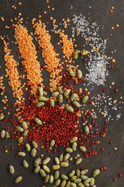 Dried Lentils Soya Beans Red Peppercorns Rock Salt Scattered Slate — Stock Photo, Image