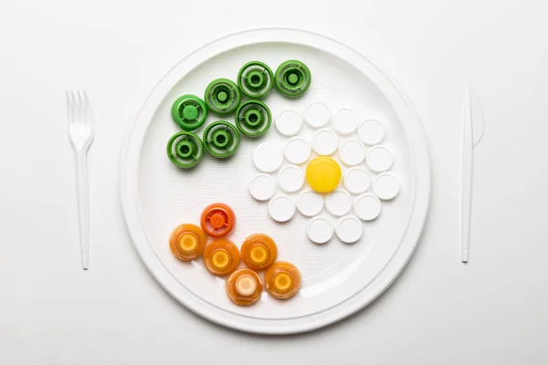 Comida de gorros plásticos . — Fotografia de Stock