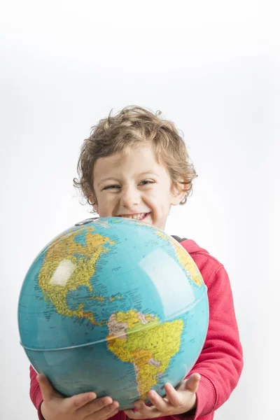 Child holding a globe in his arms. — Stock Photo, Image