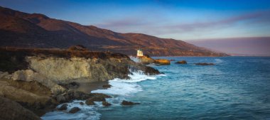 Colorful coastal view of Leo Carrillo State Beach at sunset from Sequit Point, Malibu, California clipart