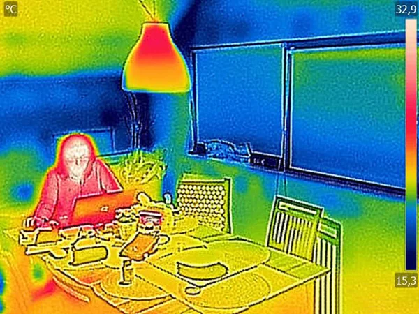 Thermal image Photo while woman on a laptop