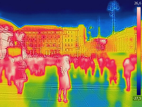 Infrared Thermal image of people walking the city streets, on a cold winter day