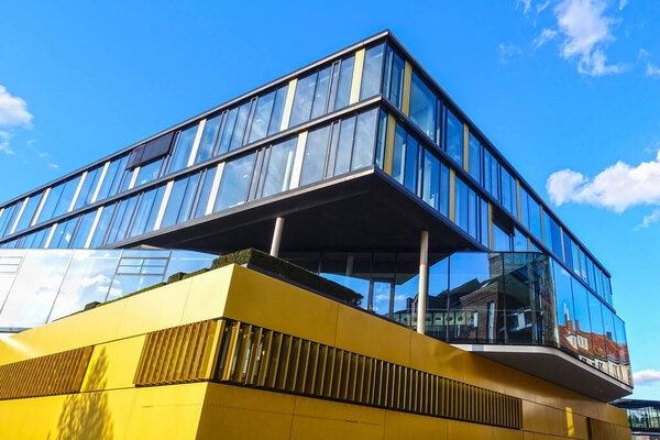 AACHEN, GERMANY - MARCH 29, 2018: Street view of the modern office building of the headquarter of the AachenMuenchener insurance company, Aachen, designed by kadawittfeldarchitektur, Aachen, Berlin. 